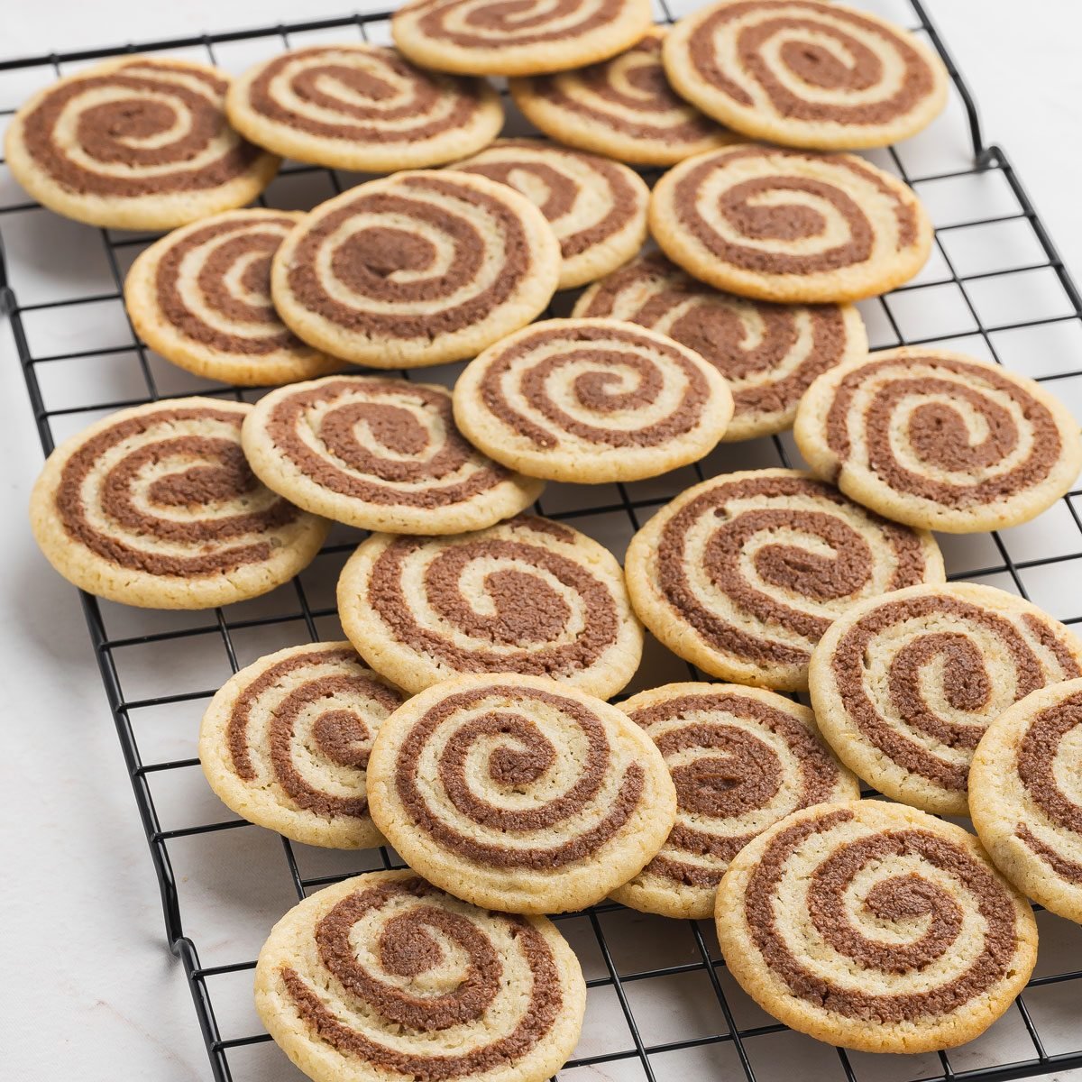 Basic Chocolate Pinwheel Cookies on a cooling rack