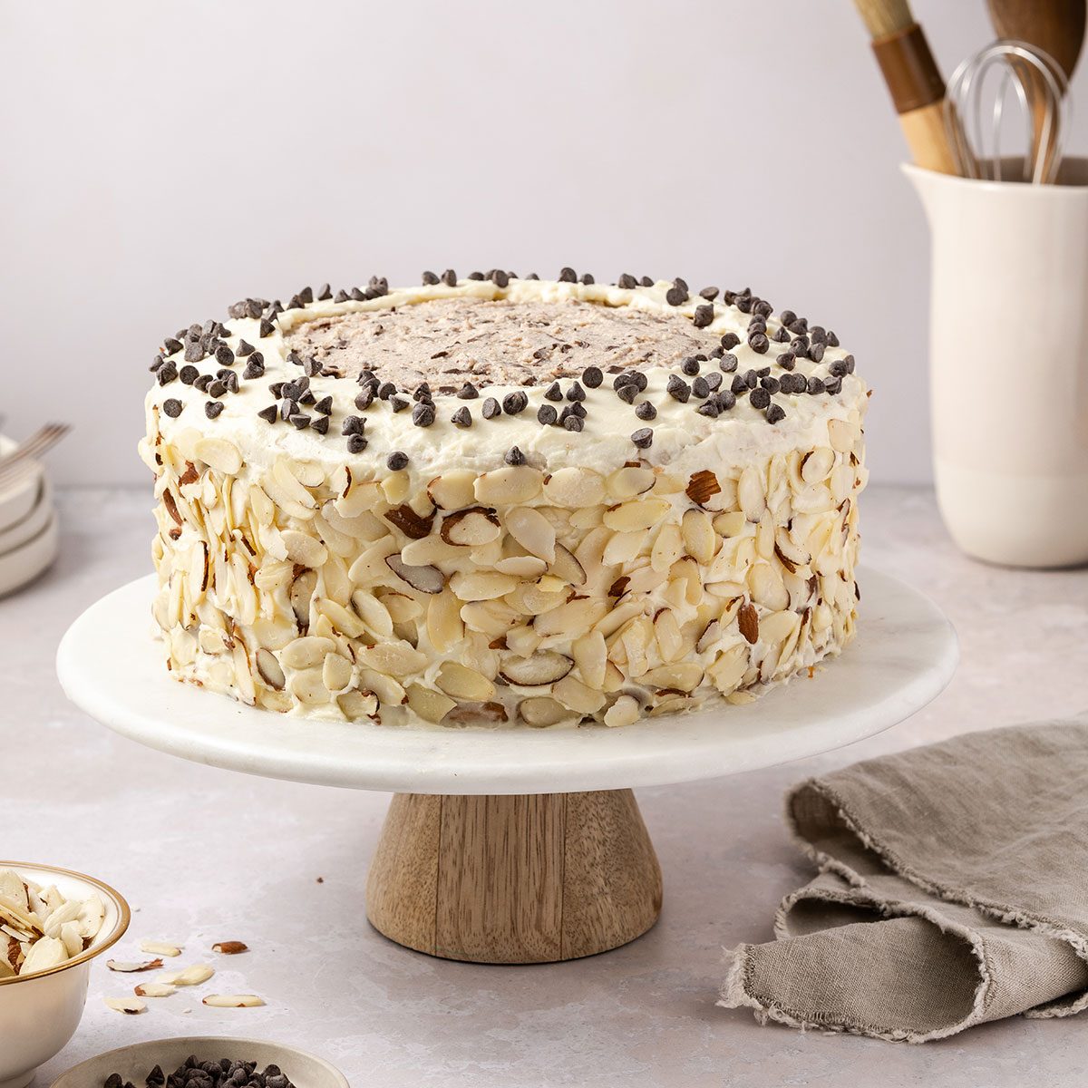 Cannoli cake ready to serve on cake stand.