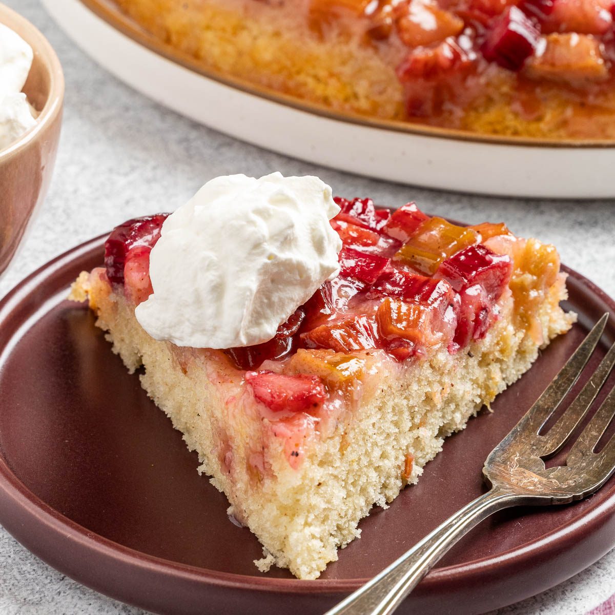 the finished Rhubarb Upside Down Cake cut into slices and served on plates.
