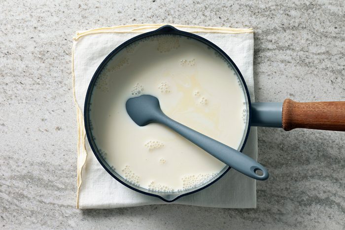 Heat the eggnog and milk