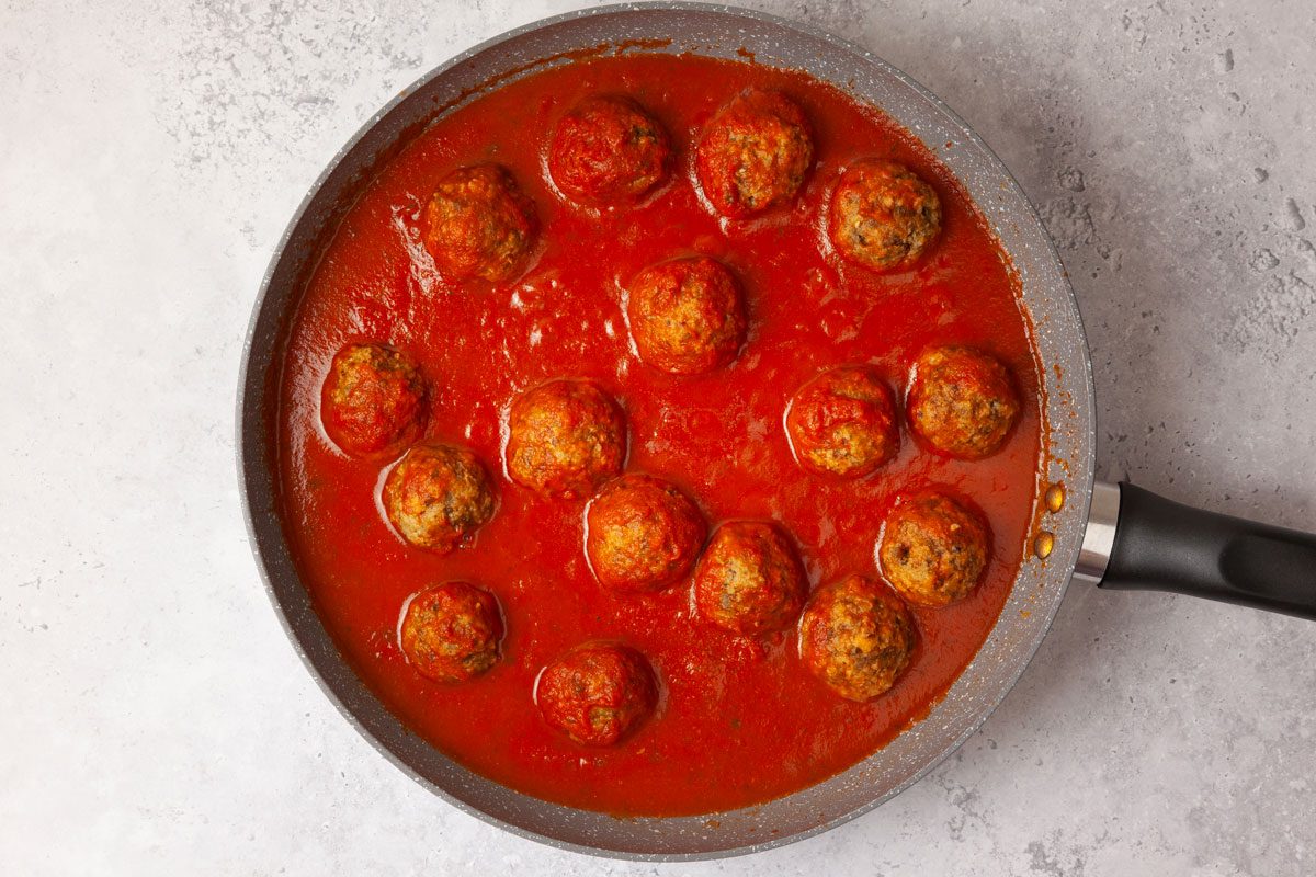 Step 5 of Taste of Home Eggplant Parmesan Meatballs is to add the marinara sauce