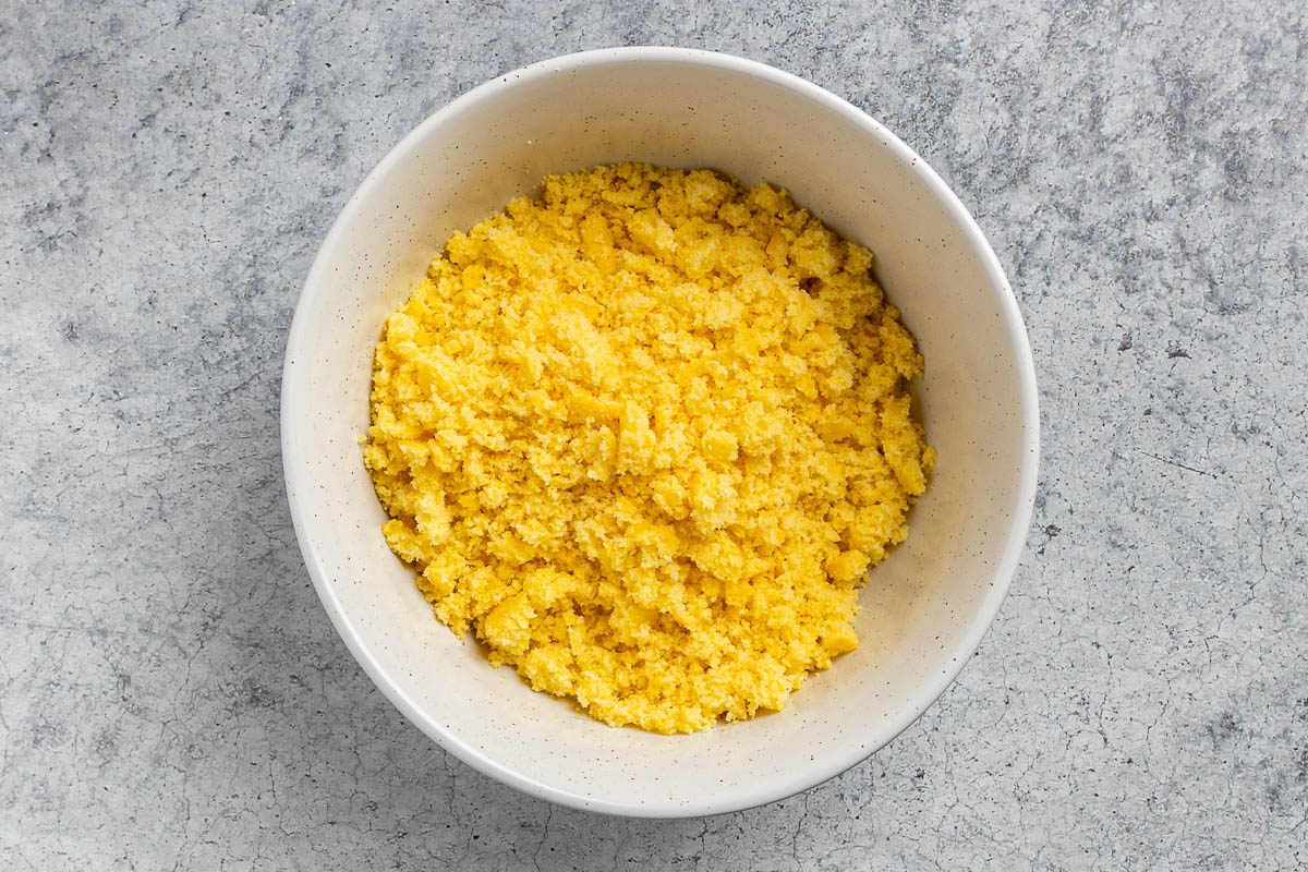 crumbled cornbread in a large mixing bowl.