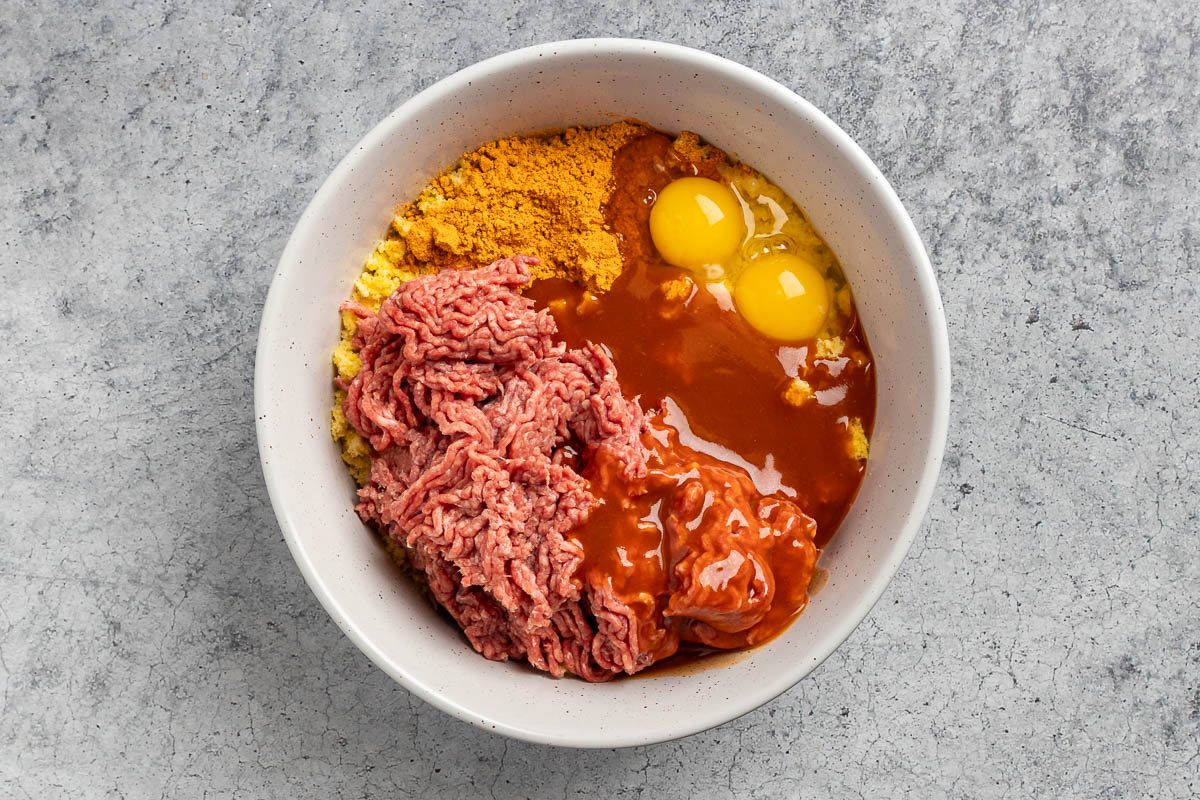 meatball ingredients added to the mixing bowl.