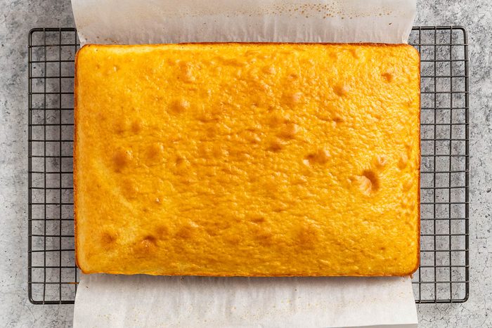 the baked cake cooling on a wire rack.