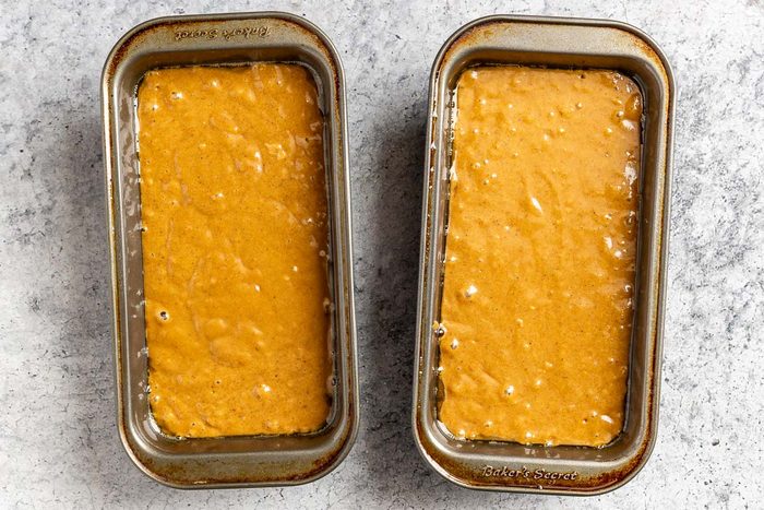 Taste of Home Gingerbread Loaf photo of combining the wet and dry ingredients and pouring the mixture into two loaf pans.