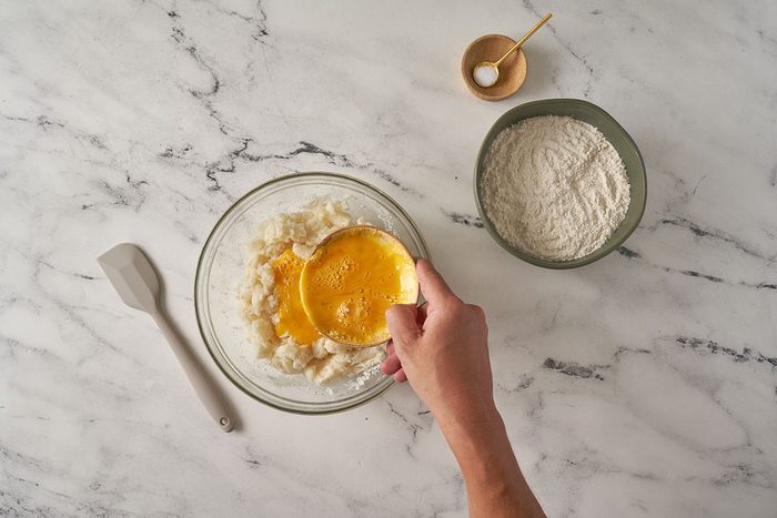 Mix potato flakes with boiling water, eggs, flour, and salt to form a dough. Roll the dough into ropes and cut into pieces for the homemade gnocchi in this Gnocchi Bolognese by Taste of Home.