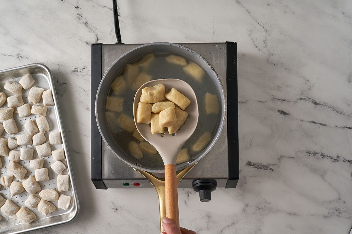 Cook the gnocchi in boiling water until they float, then gently stir them with the beef tomato sauce and top with Parmesan for serving in this Gnocchi Bolognese by Taste of Home.