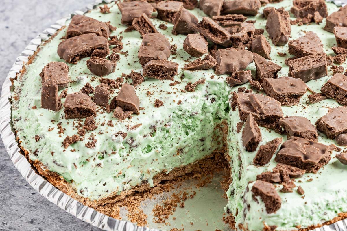 Taste of Home Grasshopper Pie photo of the finished recipe cut into slices and served on a plate.
