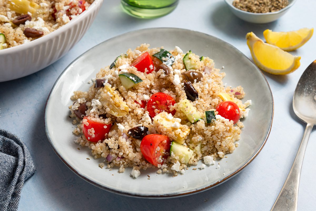 Greek Quinoa Salad Inside Bowl With Lemon And Oregano