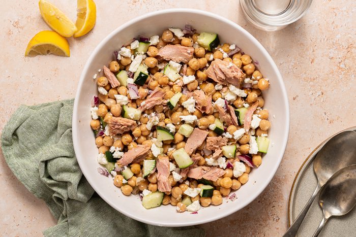 Greek Tuna Salad Mixed Inside Serving Bowl With Lemon