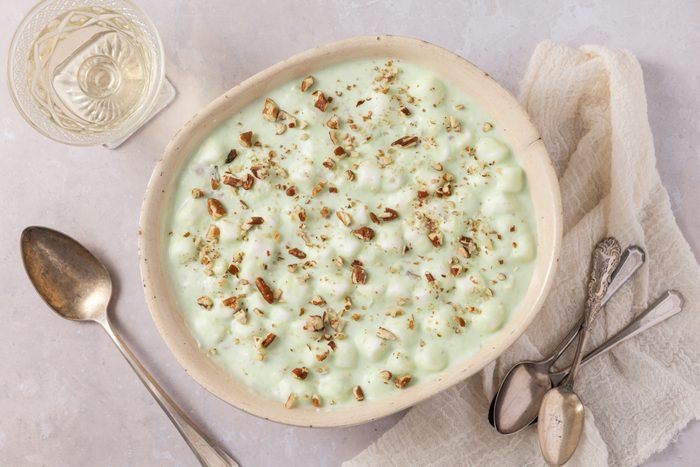 Green jell-o salad ready in serving dish.