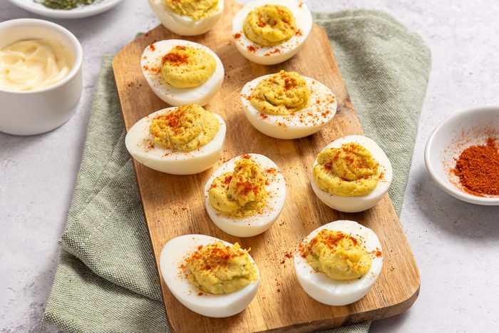 Horseradish Deviled Eggs On Wood Board