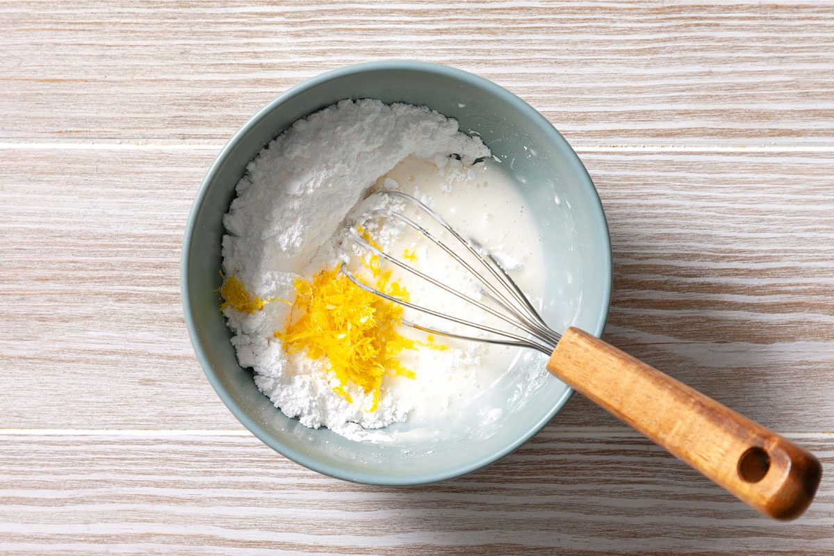 Mix The Grated Lemon Zest And Juice With Confectioner's Sugar