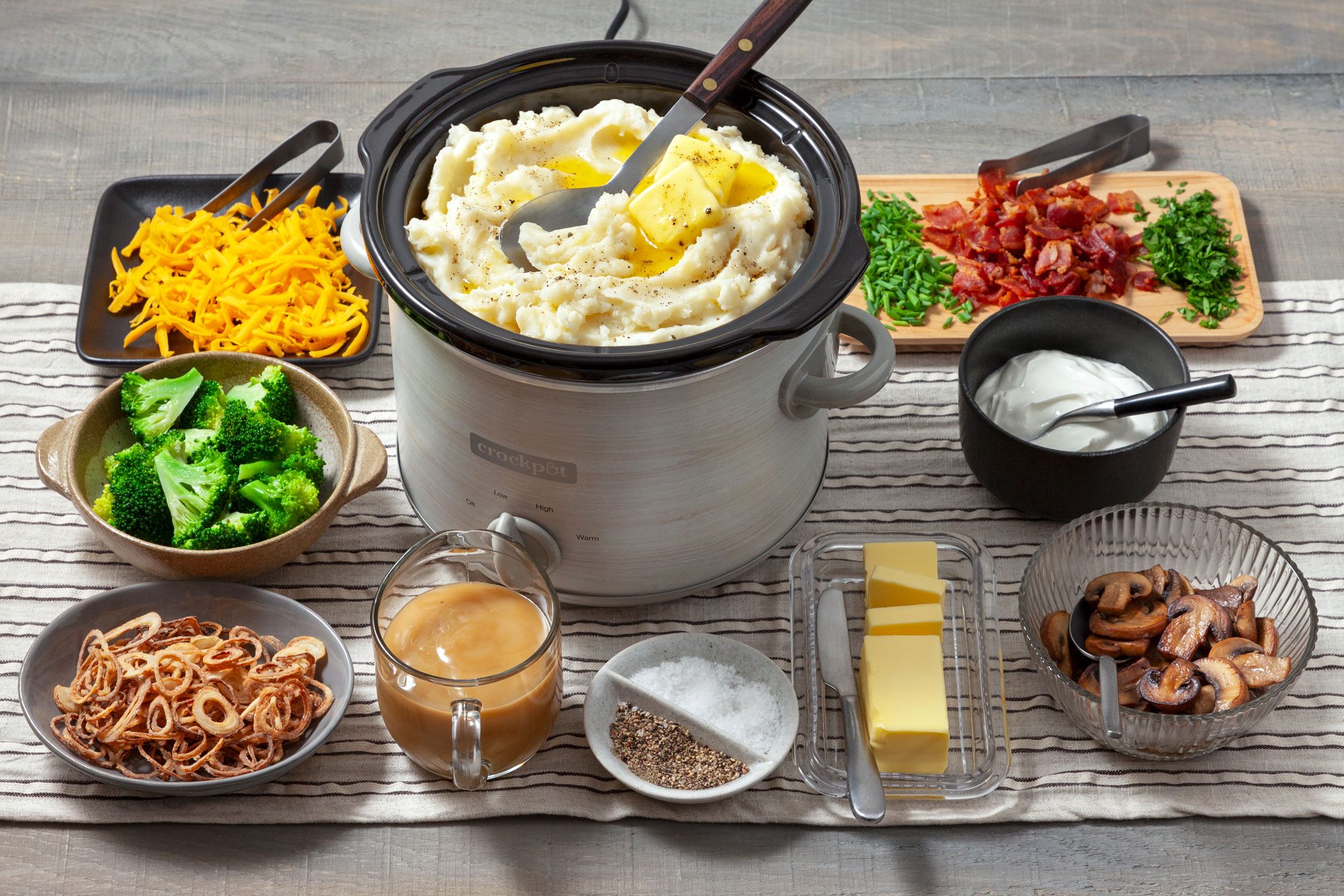 High angle view shot of all ingredients for Mashed Potato Bar; induction; table cloth; wooden surface;