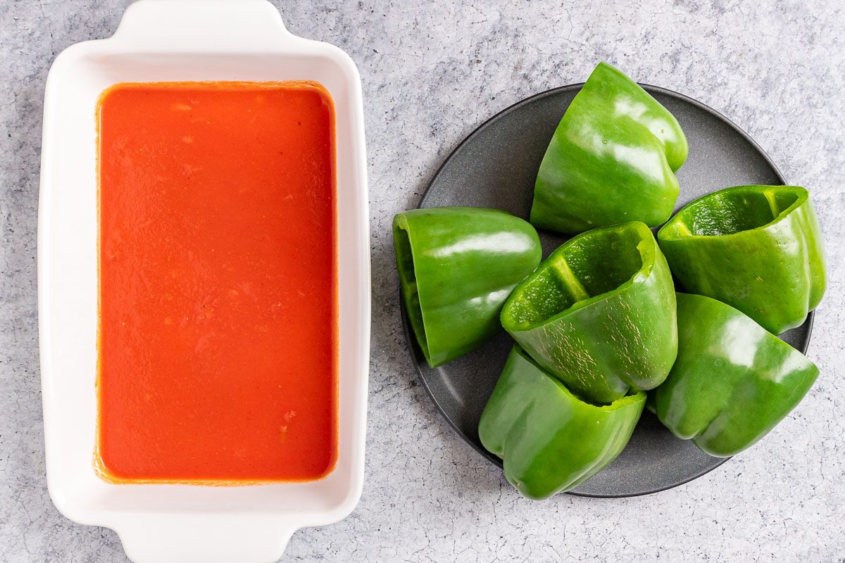 Taste of Home Meatloaf Stuffed Peppers photo of the prepared peppers and sauce.