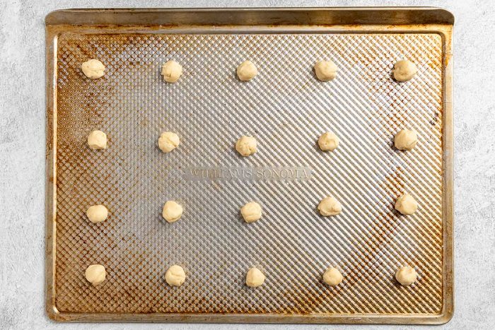 portioned raw dough on cookie sheets.
