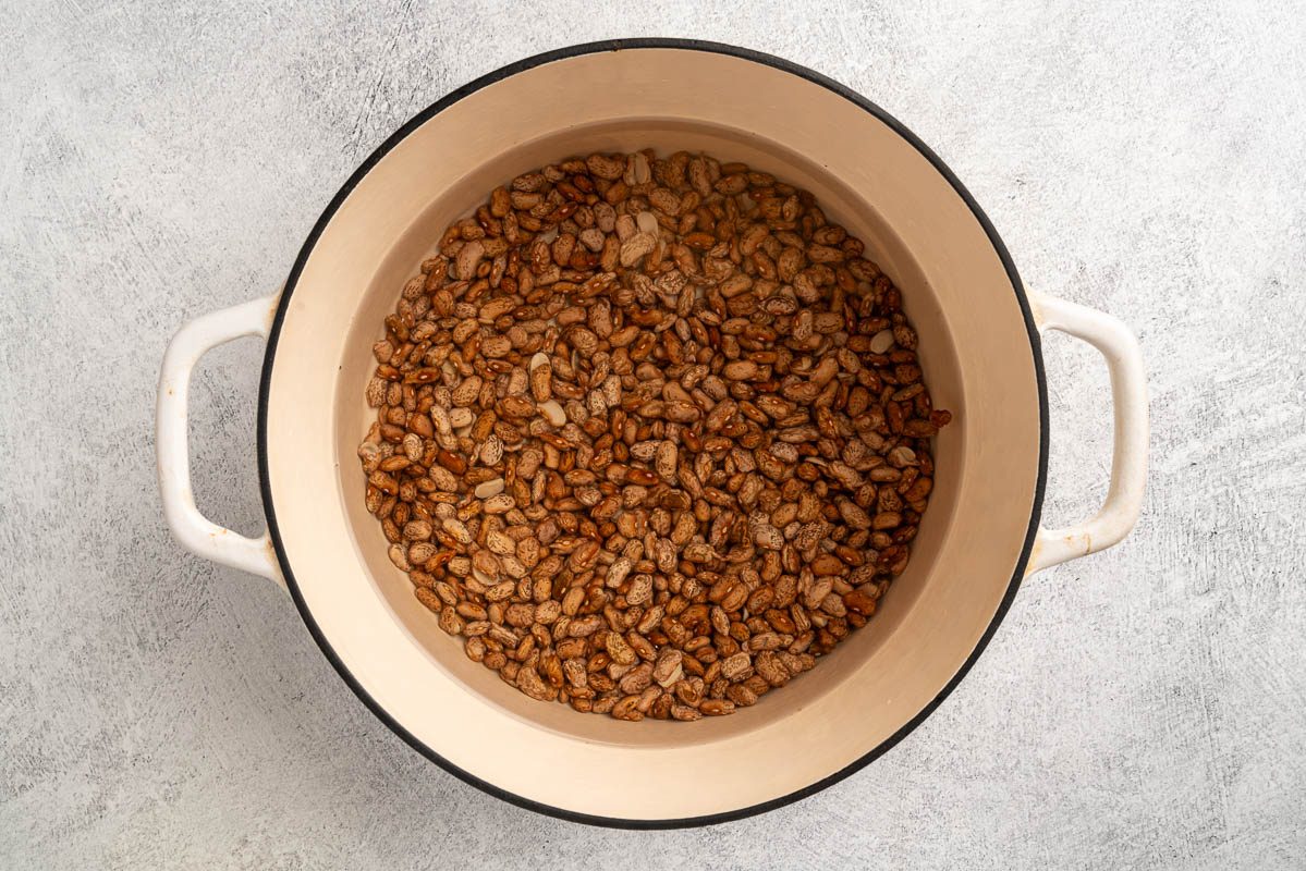 the dried pinto beans covered in cold water.