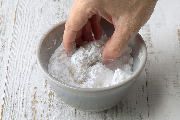 Sugar coating cookies in confectioner's sugar