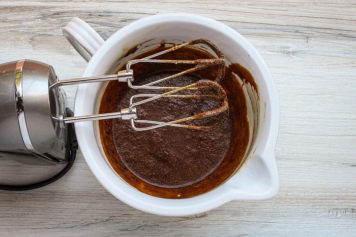 Beating the sugar, molasses, and egg for an old-fashioned molasses cake from Taste of Home.