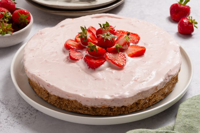 No Bake Strawberry Cheesecake On Serving Plate