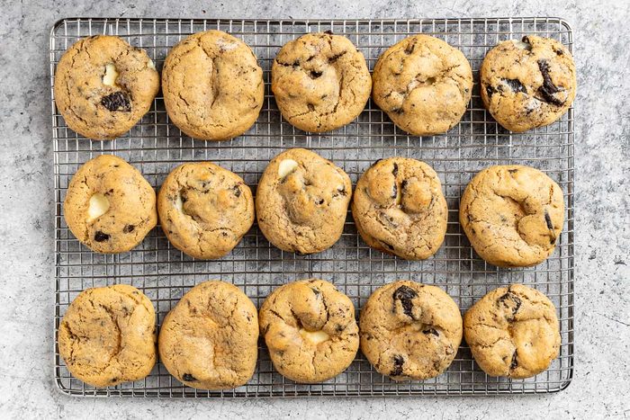 Taste of Home Oreo Cheesecake Cookies photo of the baked cookies on a cooling rack.