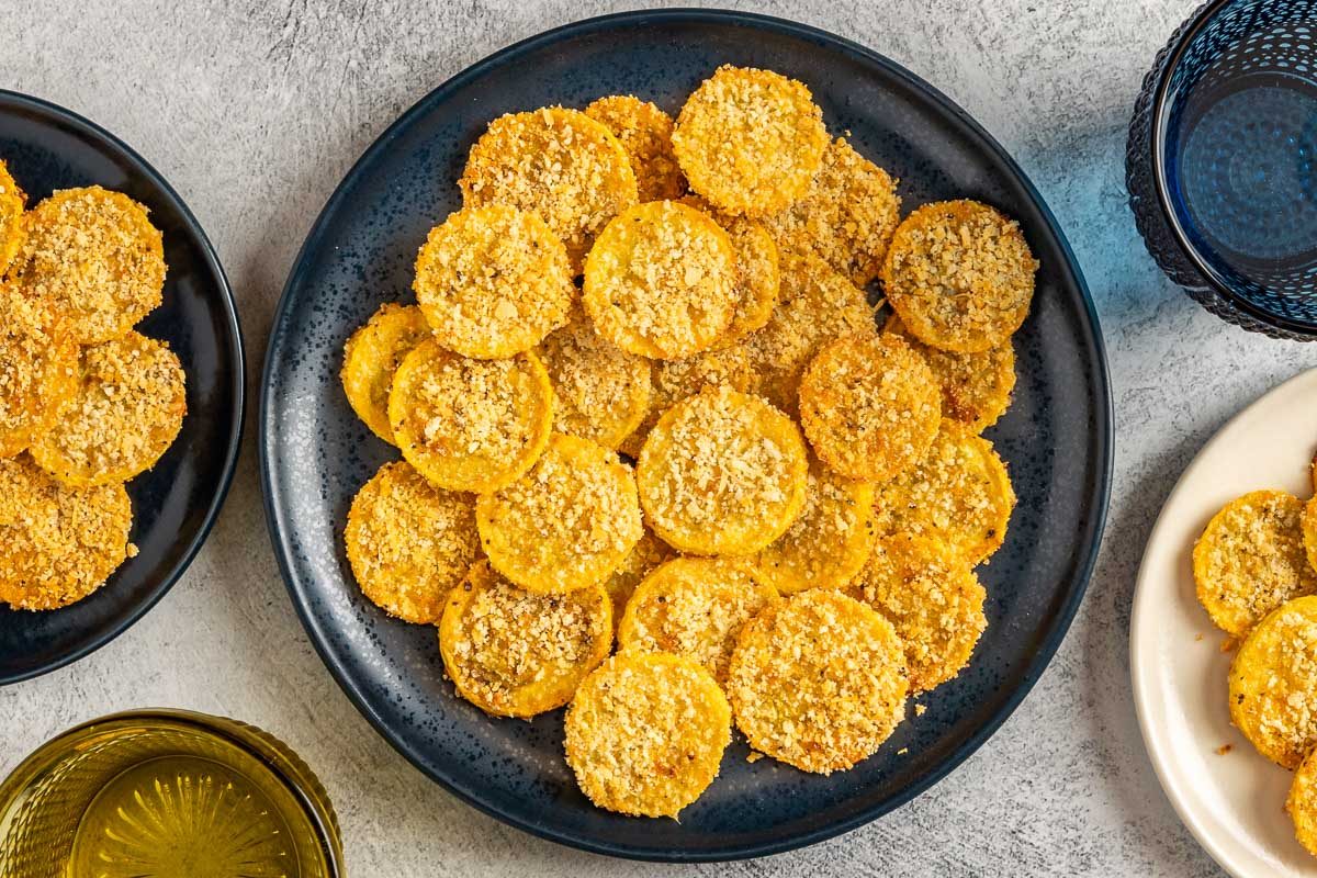 Taste of Home Oven Fried Squash photo of the finished recipe served on a serving dish and plates.