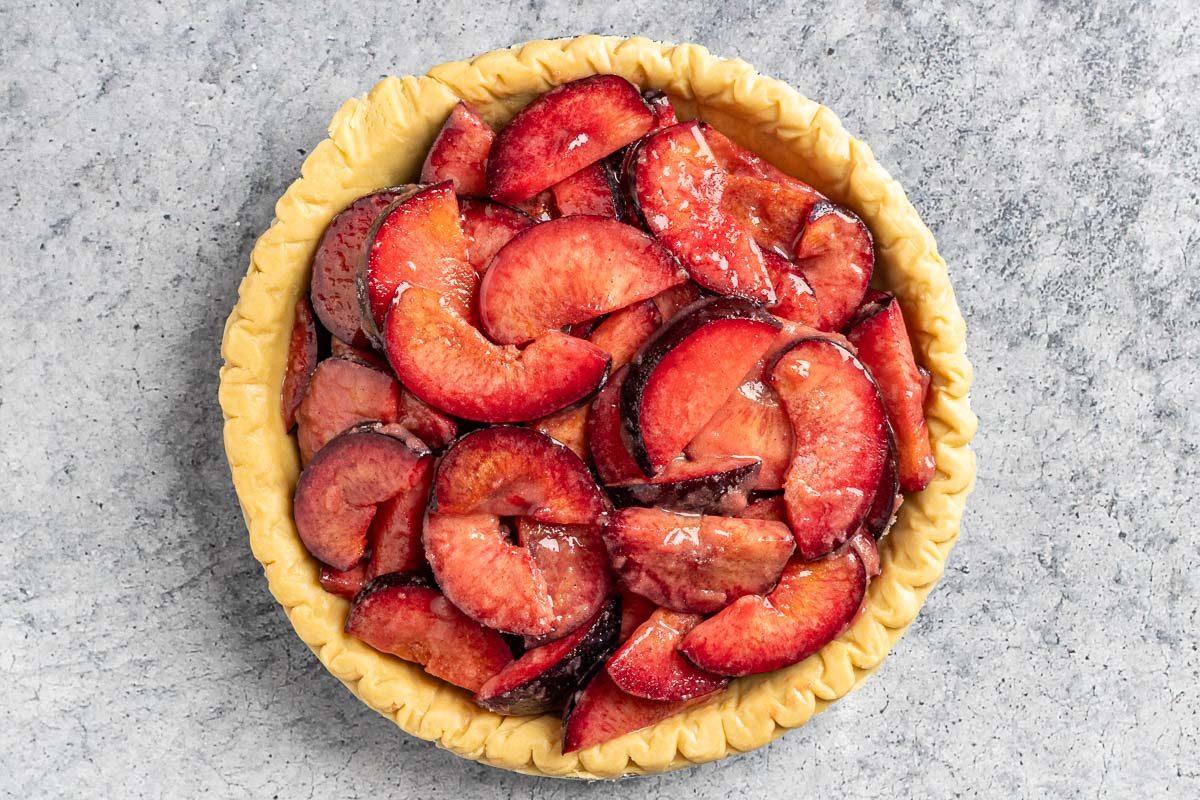 Taste of Home Plum Pie photo of the pie filling set in the prepared pie crust.