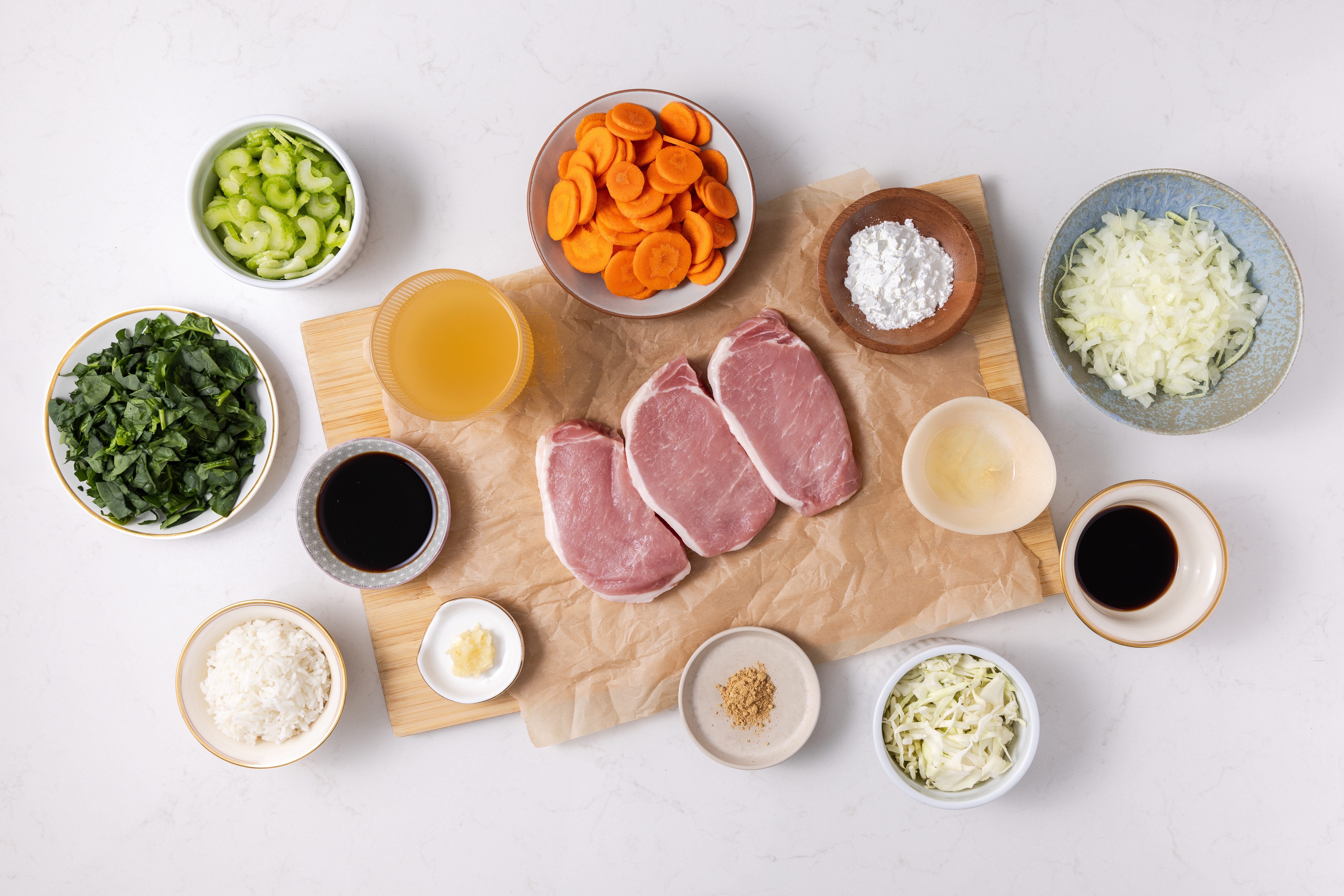 Ingredients for pork chow mein on kitchen counter.