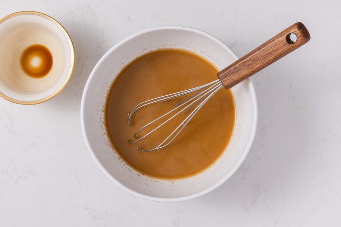 Sauce for pork chow mein being mixed in small bowl.