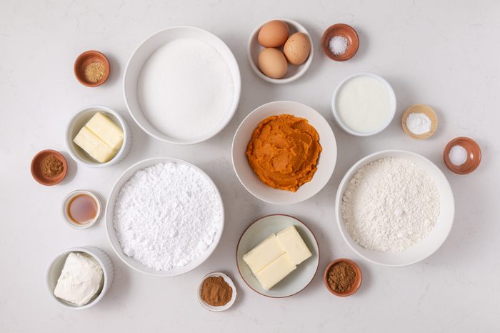 Ingredients for pumpkin cupcakes on kitchen counter.
