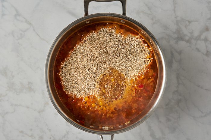 Cook stock and quinoa