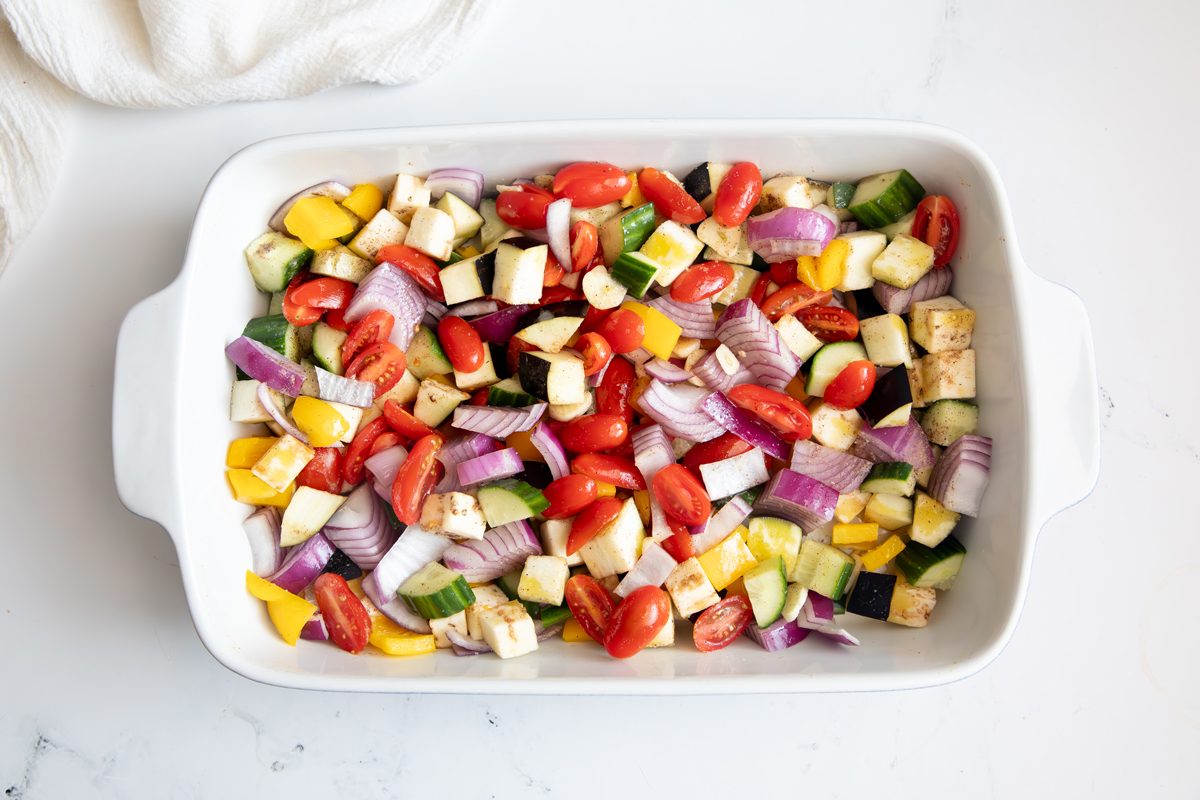 Overhead shot for Taste of Home Quinoa with Vegetables, ingredients in a baking dish ready to be roasted.
