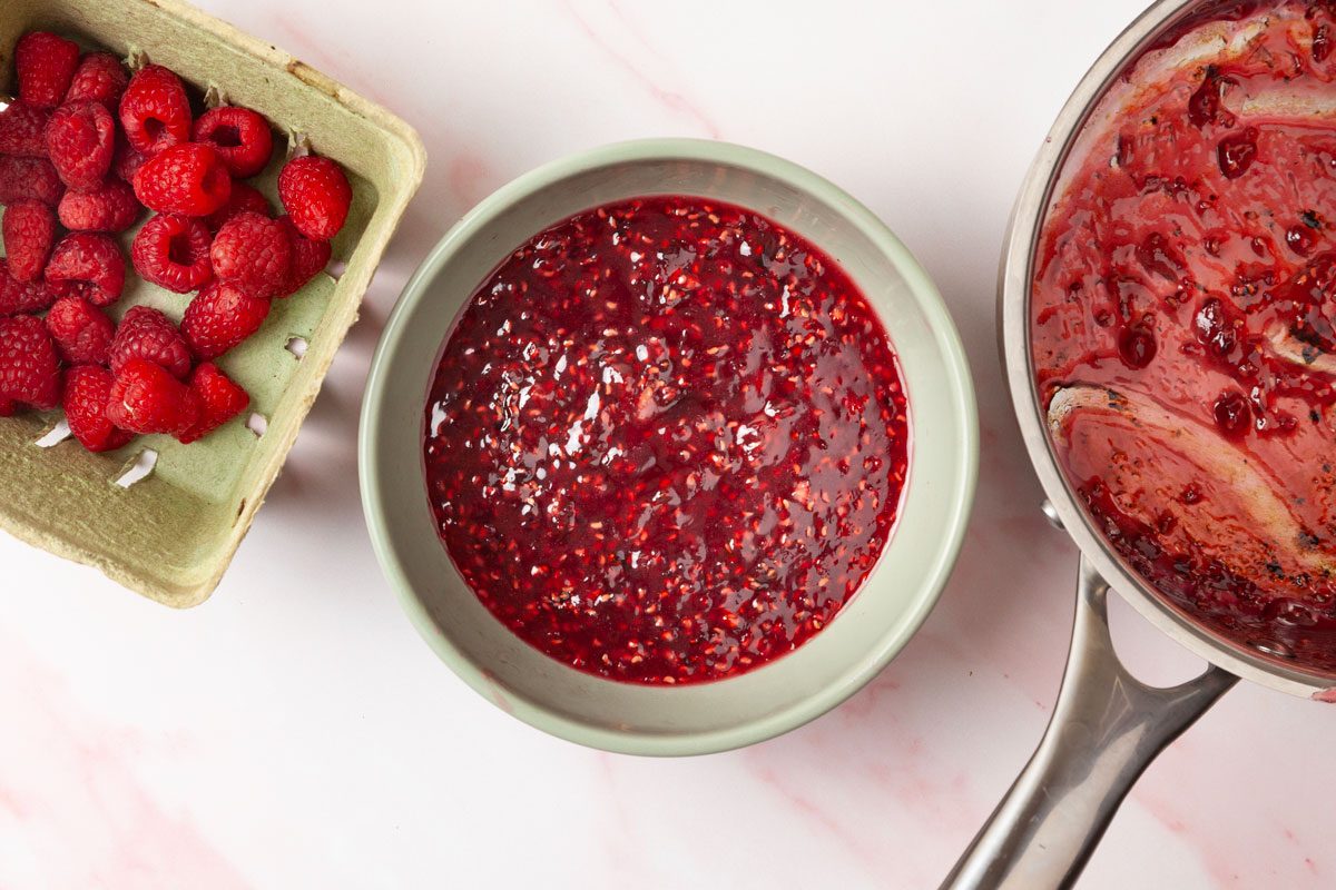 Step 5 of Taste of Home Raspberry Cheesecake is to combine the sugar and cornstarch, then stir in the water and 1-1/2 cups of fresh raspberries. Bring to a boil, then cook and stir for two minutes or until thickened. Transfer to a bowl and refrigerate until chilled.