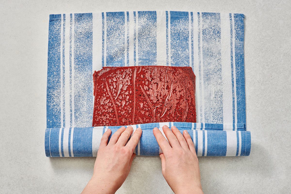 Rolling up the cake in a towel jelly-roll style
