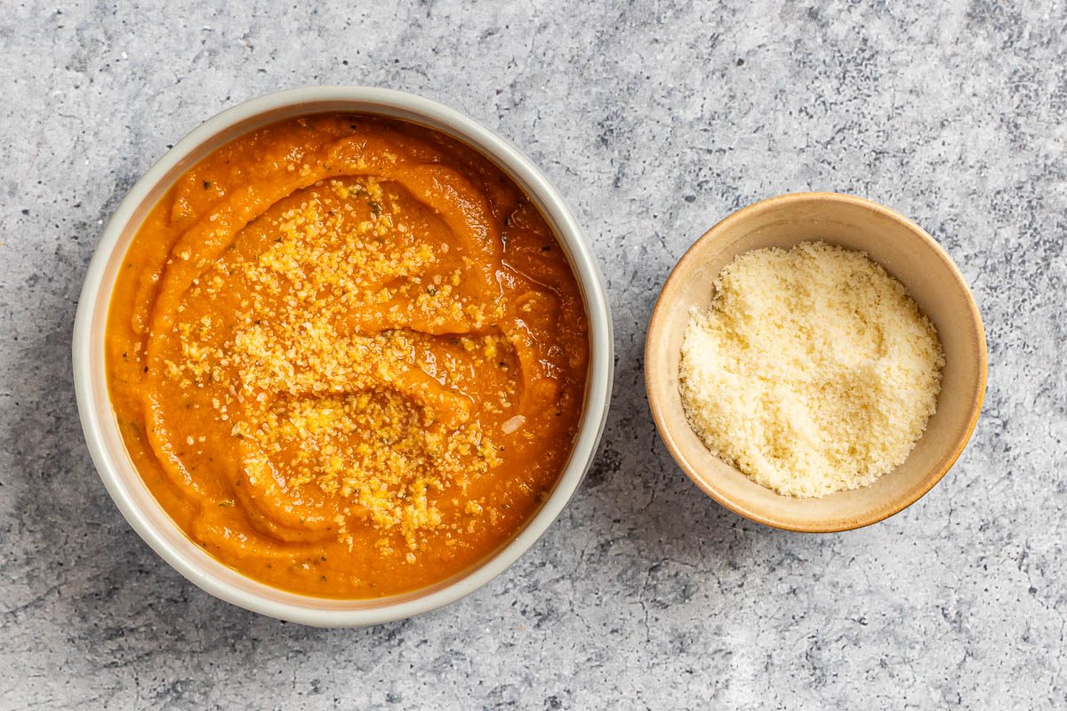 Taste of Home Roasted Vegetable Soup photo of the soup in a bowl topped with Parmesan cheese.