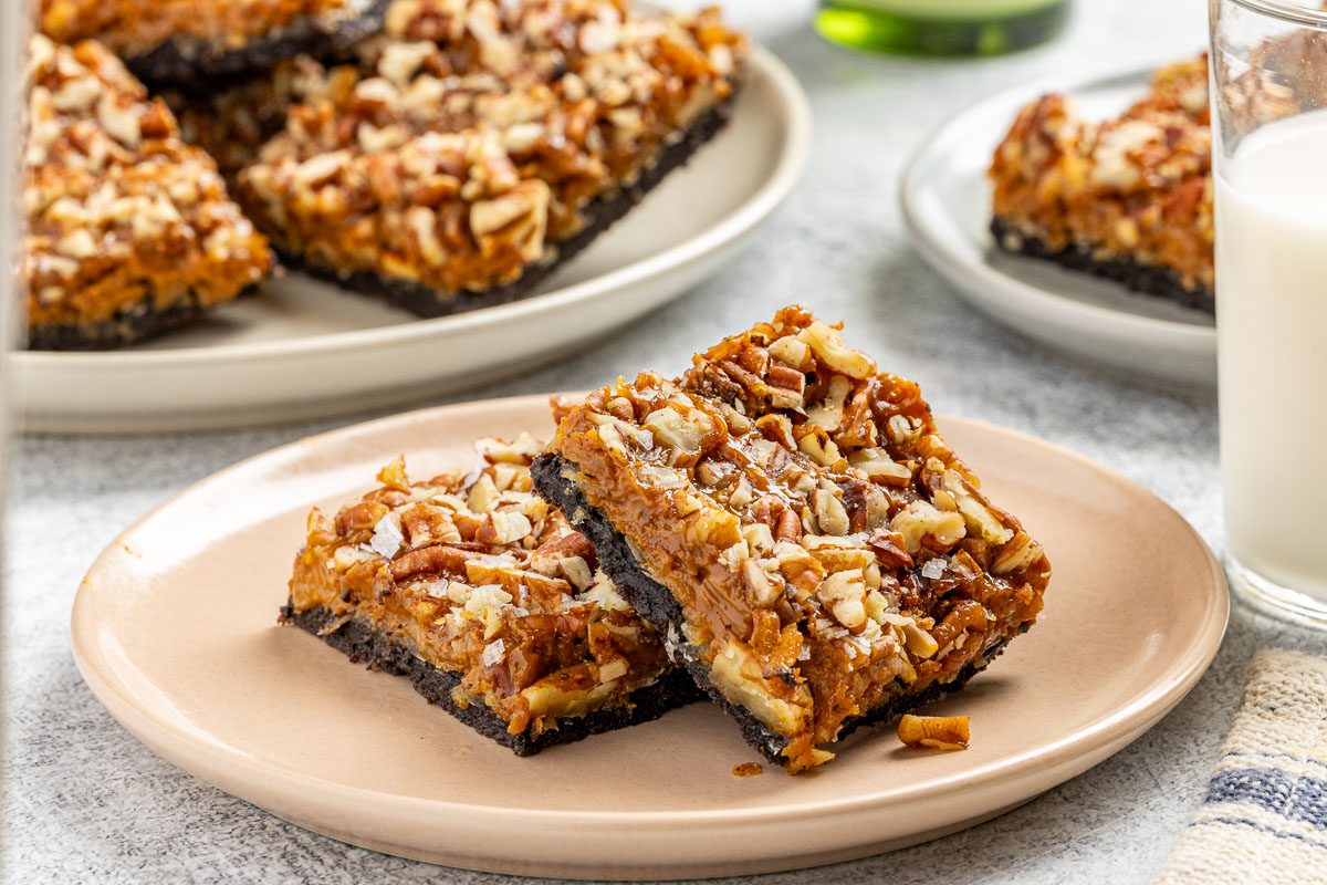 Seven-Layer Cookies cut into squares and set on plates.