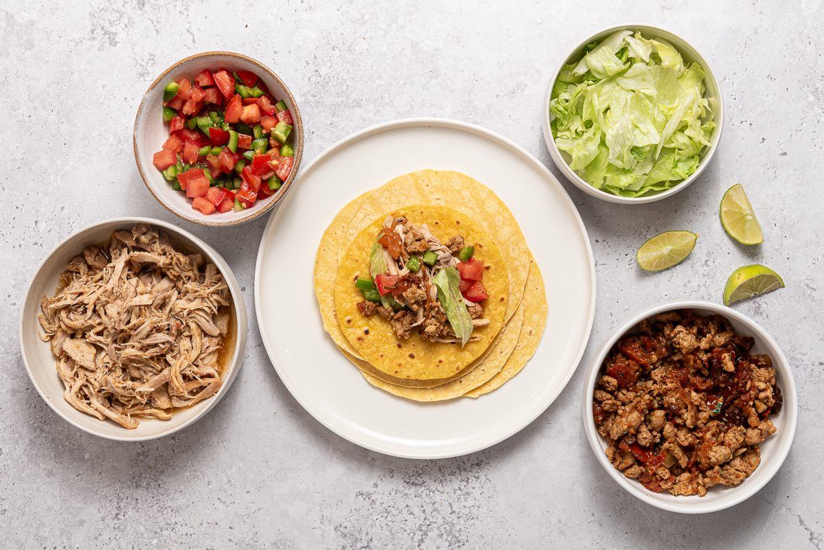 Bowls With Chicken, Chorizo, Chipotle, Lettuce And Corn Tortilla