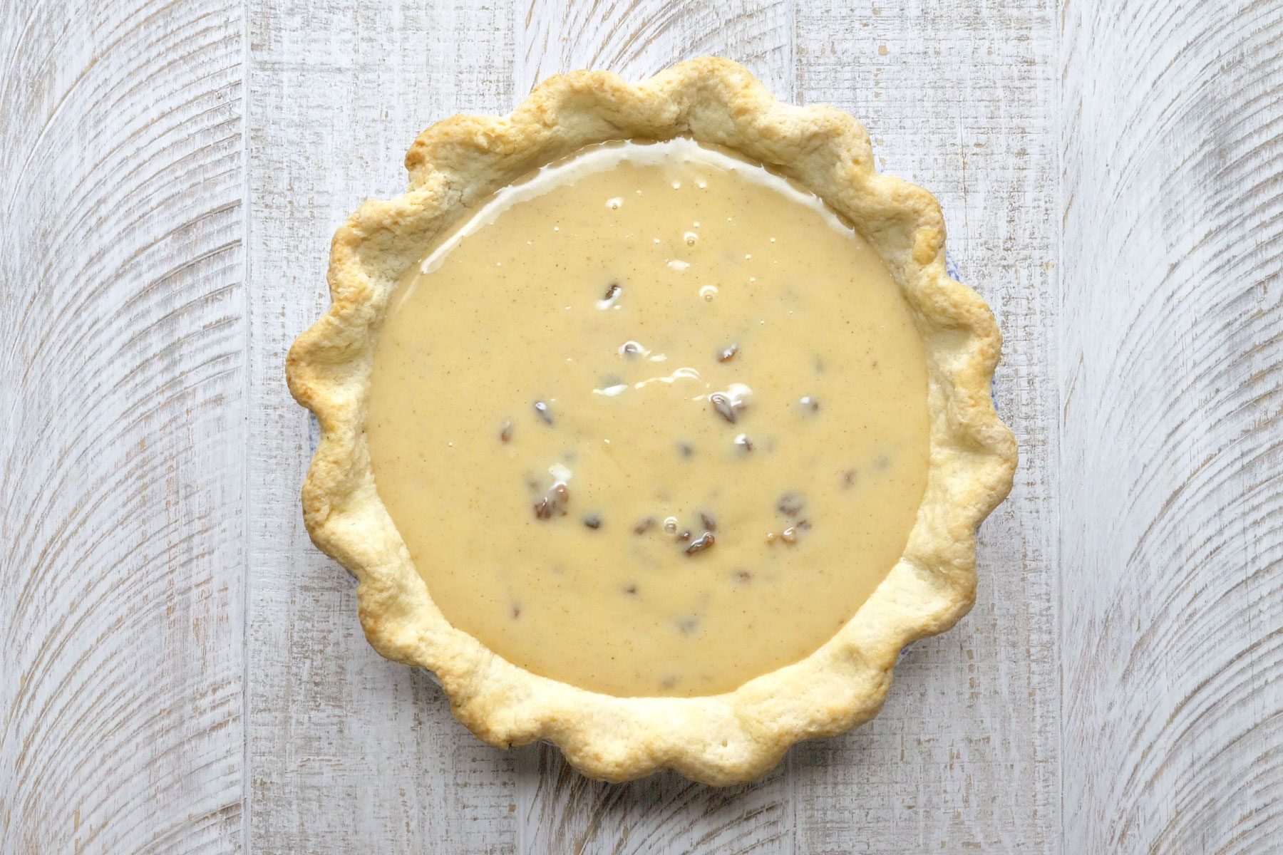Custard poured into pie crust.