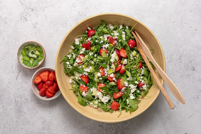 Bowls With Arugula, Strawberries, Feta Cheese And Green Onion