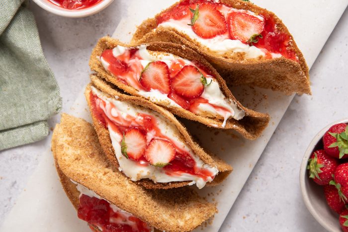 Straberry Cheesecake Tacos On Marble Board