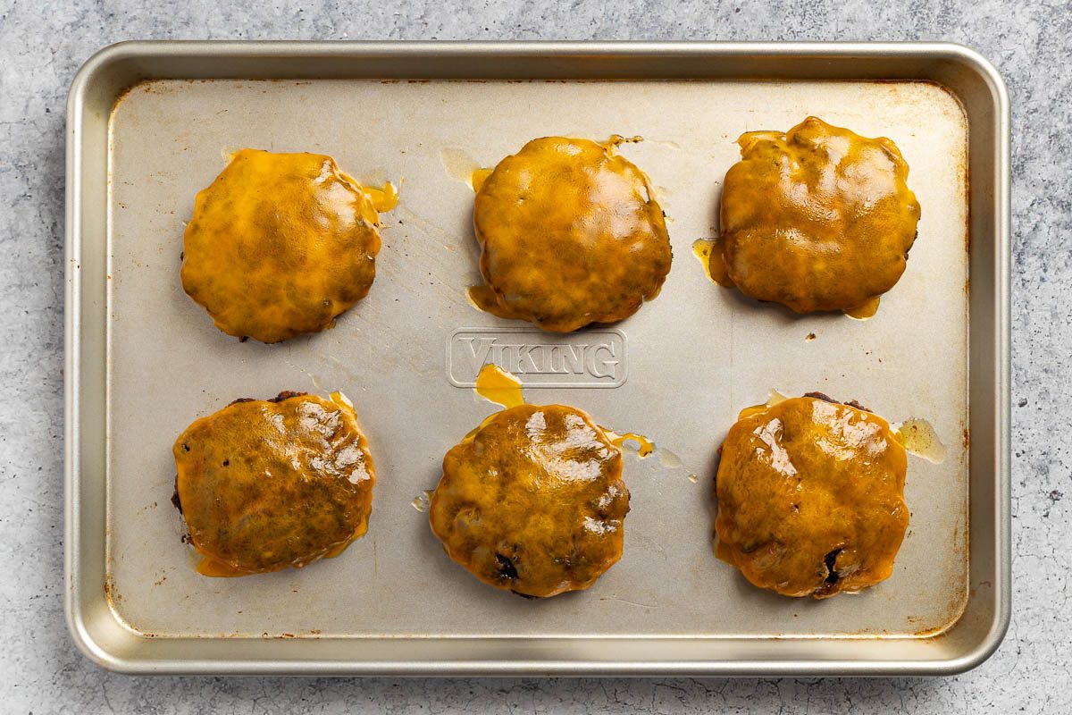 grilled burgers topped with cheese.