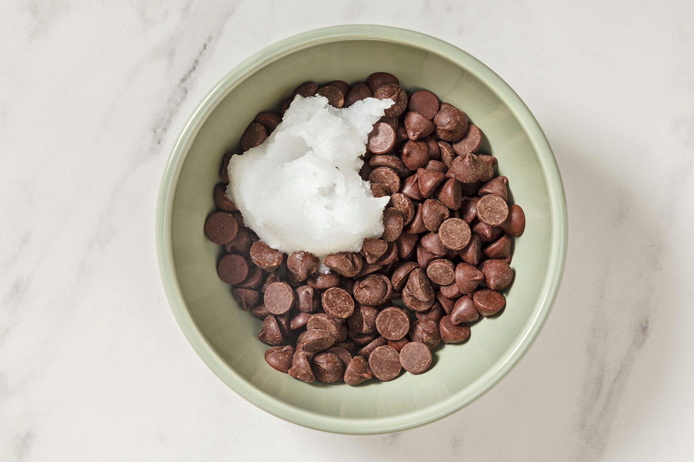 Choco chips and coconut oil in a bowl