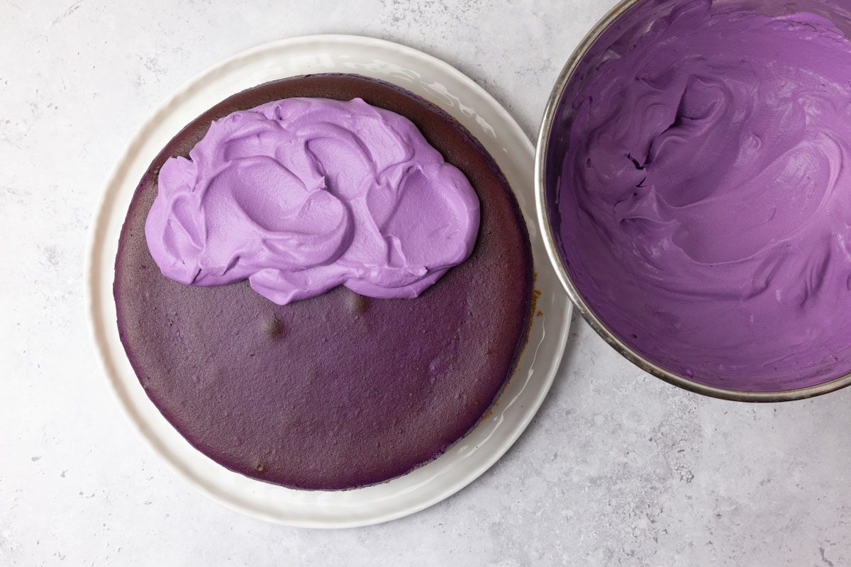 Step 4 of Taste of Home Ube Cheesecake is to make the whipped cream frosting and frost the cheesecake