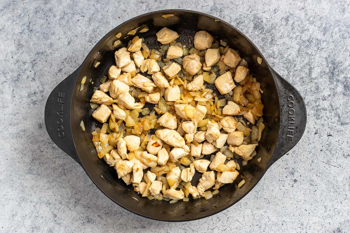 Taste of Home White Lasagna Soup photo of the sauteed chicken and onions.