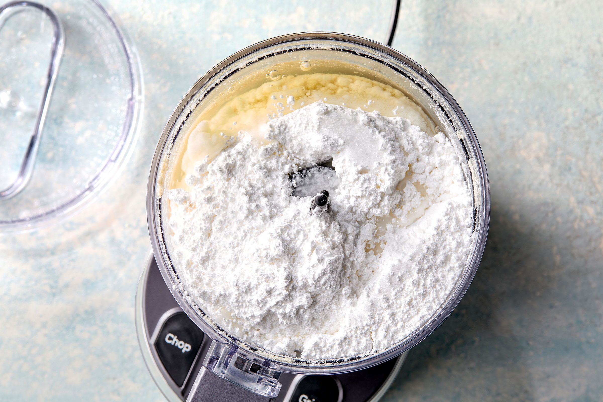 Confectioners' sugar on processed almond paste