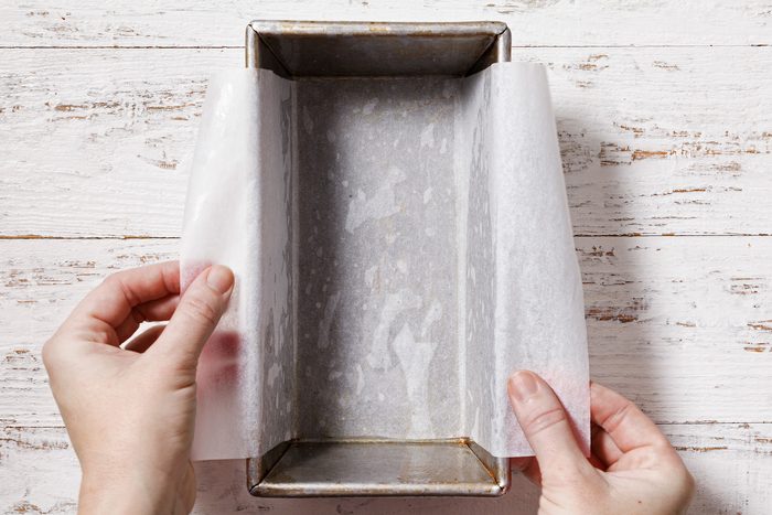 Grease a loaf pan, line with parchment, letting ends extend over sides.