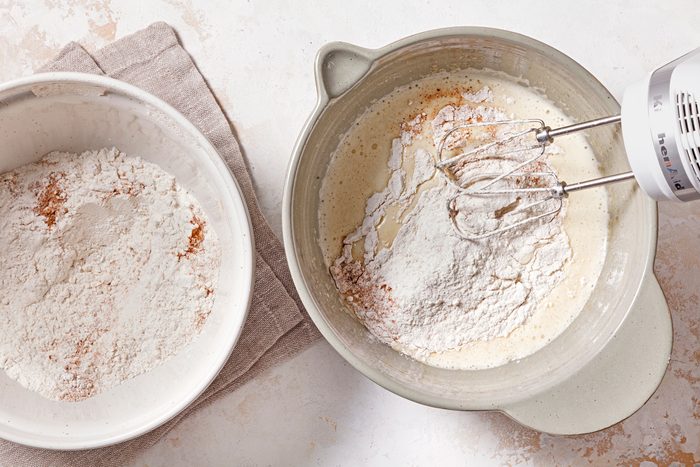 In a small mixing bowl, whisk together flour, cinnamon, baking powder, baking soda, salt and nutmeg.