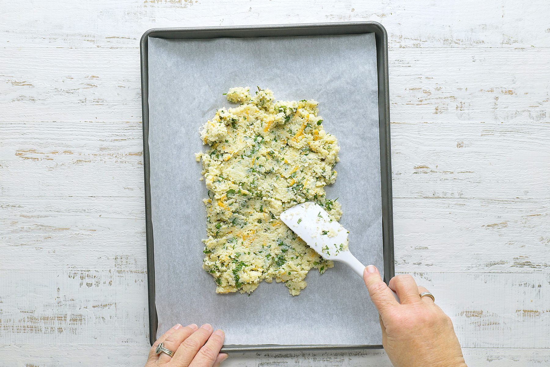 On a baking sheet lined with parchment, shape cauliflower mixture into an 11x9-in. rectangle.