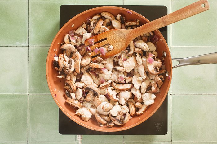 Chicken and onions in skillet