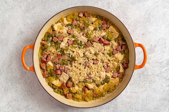 Taste of Home Chicken Jambalaya photo of cooking the chicken and most of the jambalaya ingredients in a skillet.